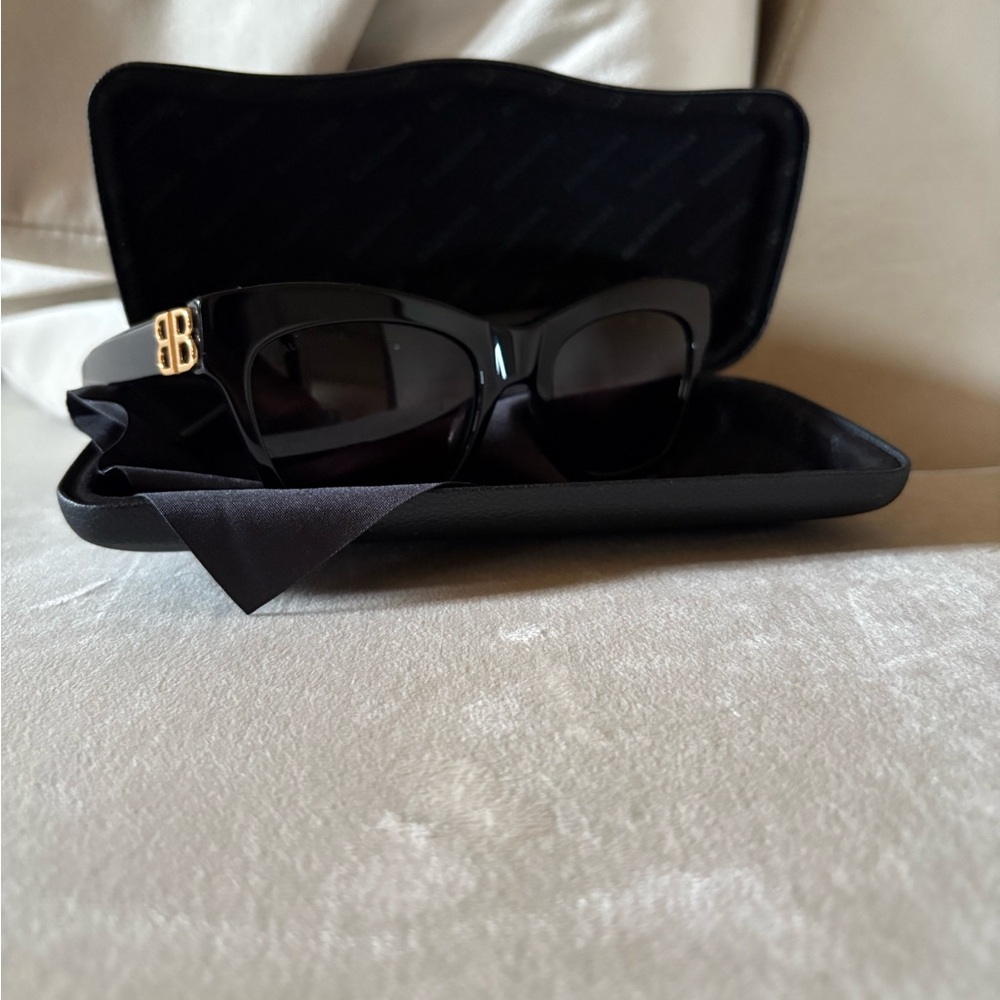 Black Balenciaga glasses with gold BB print